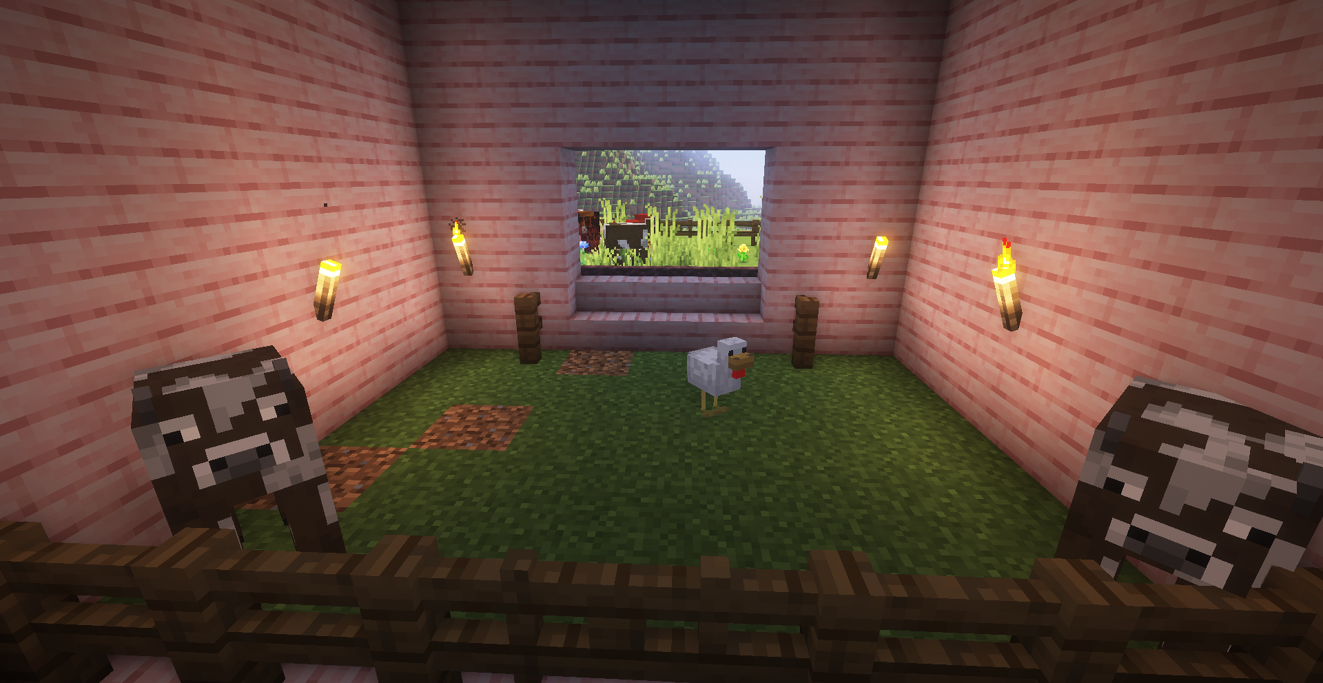 A view of the barn's interior. There is an opening on the
other side of the room, leading to a pen outside. Animals can move freely between the barn and outside.